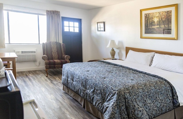 Quaint Single King Hotel Room overlooking the Gunnison River and your Private Patio! Perfect for fishing and exploring the outdoors.
