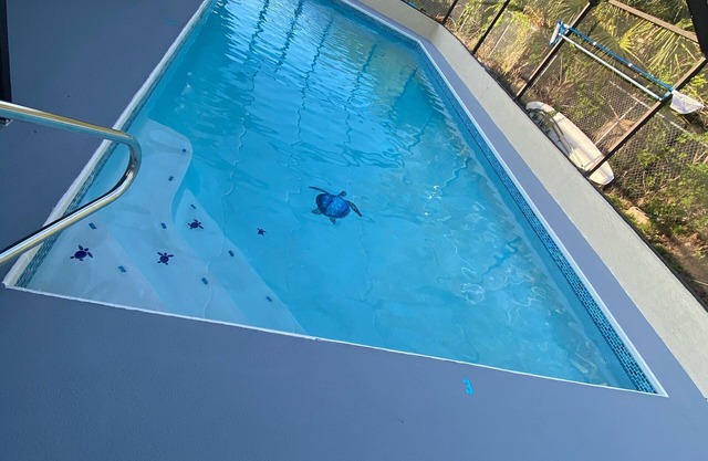 Quiet Gulf Canal Neighborhood with Enclosed Lanai & Heated Pool EV friendly