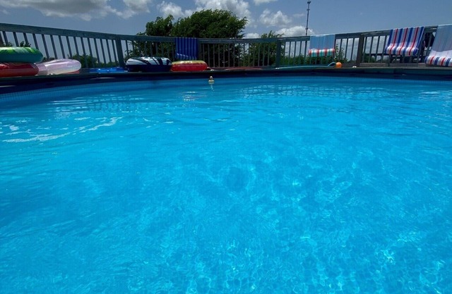 Quite peaceful cabin resort with pool and BBQ area with firepit!