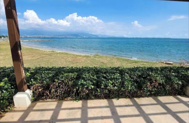 Relax by the pool with the sounds of waves and enjoy ocean and mountains views