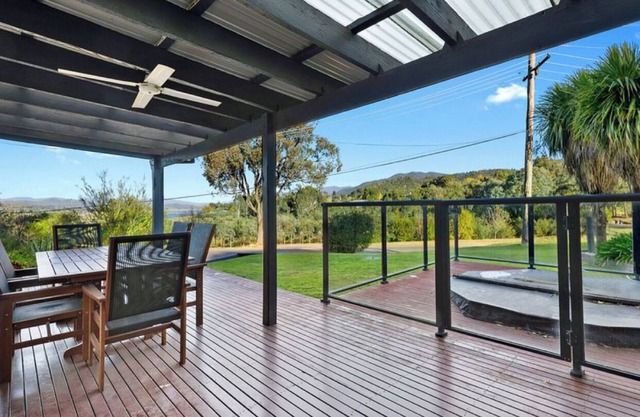 Relax in the spa with views opposite Lake Eildon