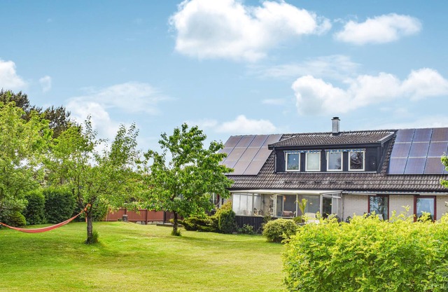Relax in this beautiful house on large plot with sea view.