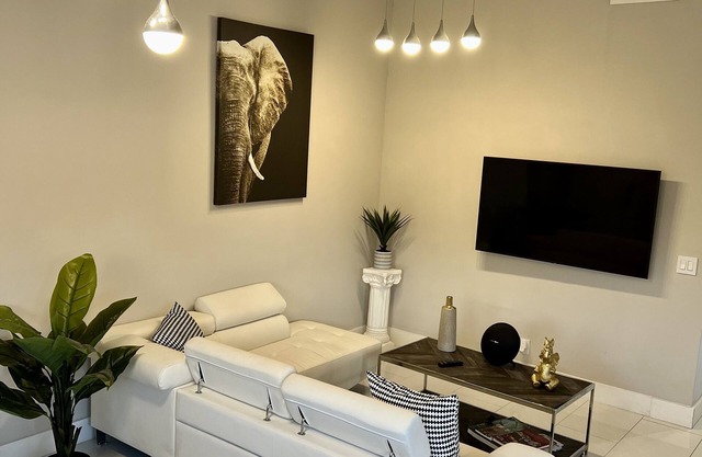 Relax in this Modern 2 Bedroom Home Close to Shopping and Highway