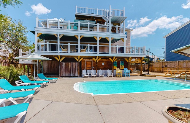 Renovated canal home with private pool, dock, roof deck, ocean/bay view, wet bar