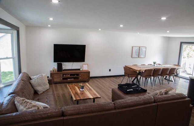 Renovated open concept family sized Home with game room and fire pit in backyard