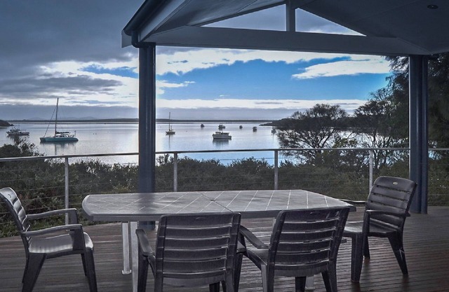 Rest A Shore is a waterfront property with spacious living and north facing panoramic view over the bay from the front deck.