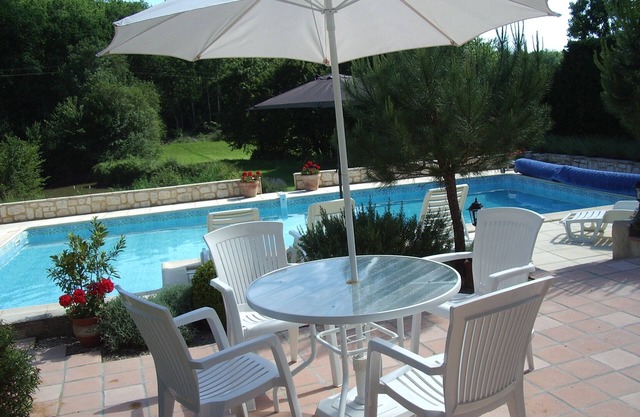 Restored house with private pool and views to the wooded hillside and small lake