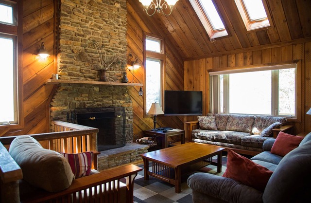 Riverfront luxury in the woods - main level master bedroom