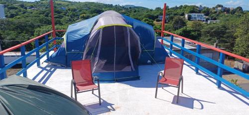 Rooster Run Camping is a - rooftop & elevated camping experience! Incredible views of The Rain Forrest and Culebra across the Atlantic Ocean - Tents, towels, comfortable Air Beds, Warm Shower-Central Location- 5 beaches -25 min walk & Ferry is 20 min