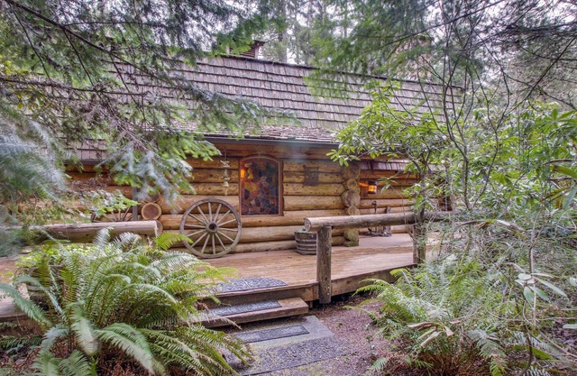 Rustic pond-front log cabin with fireplace & central AC