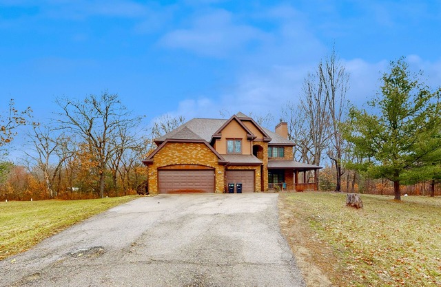 Secluded exclusive brick home with game room, fireplaces, large porch, firepit