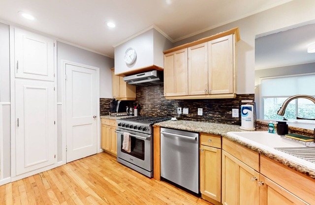 Single-level dog-friendly home with furnished deck, washer/dryer, AC