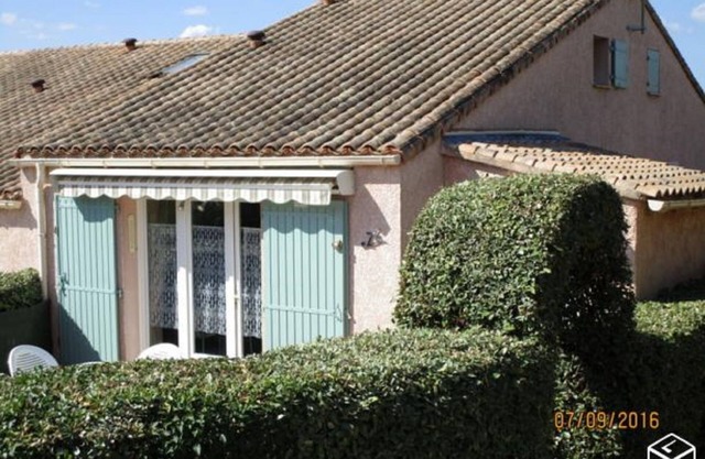 Small house in a residence with swimming pool