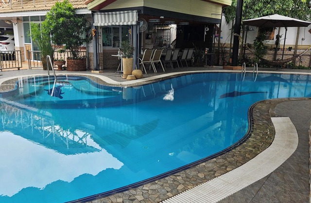 Small separate 1 BR, air conditioned house with swimming pool.