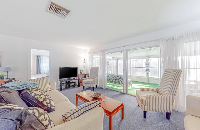 Snowbird-friendly waterfront home with water views, screened porch, streaming