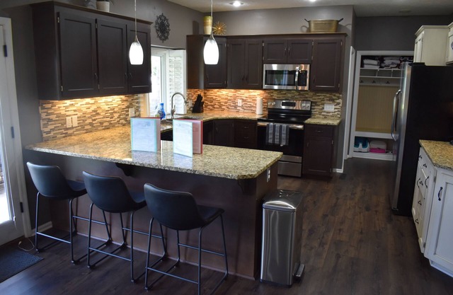 Spacious 5-bed 4-bath retreat. Backyard oasis with pool, hot tub, and fireplace.