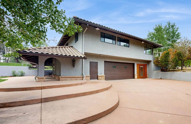 Spacious home with indoor heated pool, volley ball court, and is dog-friendly