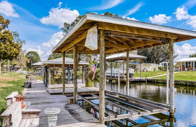 Spacious home with water view, dock, lovely patio, central AC & washer/dryer