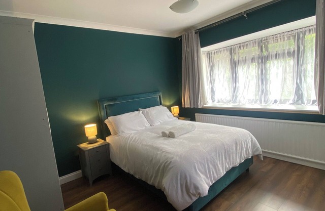 Spacious self-contained 2-bed apartment with a fully equipped kitchen dinner.