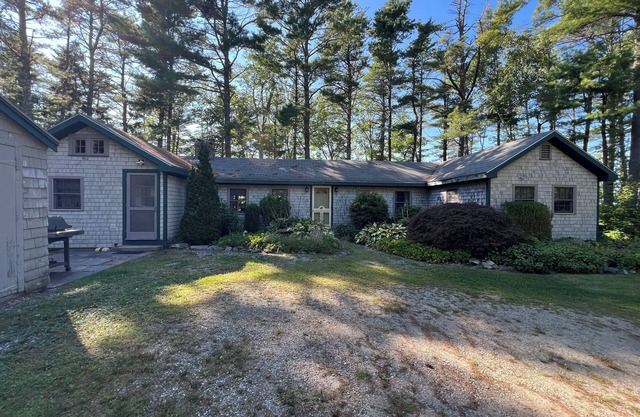 Spacious single-story cottage with ocean views, large screen porch, and a quiet location.