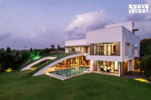StayVista at Gardenéa with Outdoor Pool, Huge Lawn