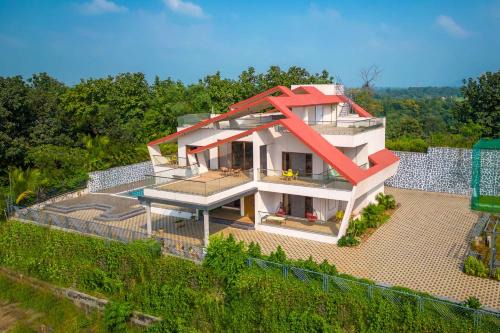 StayVista's Amorist Villa - Amidst Greenery with Terrace, Kids Zone, Snooker Table, Turf