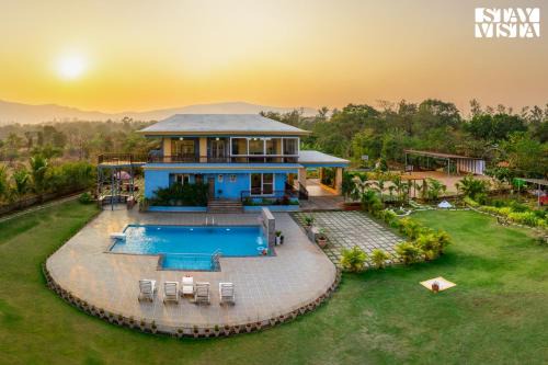 StayVista's Hillside Meadows - Mountainside Retreat with Farm View, Pool & Deck, Lawn & Gazebo