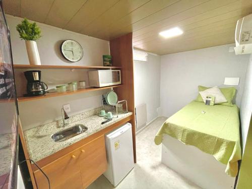 STUDIO aconchego, com Ar, Wifi, Smartv e Cozinha