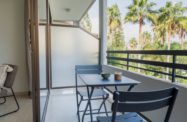 Studio with balcony and garden view