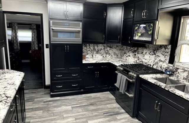 Stunning home with in ground pool, hot tub, bocce court, gourmet granite kitchen