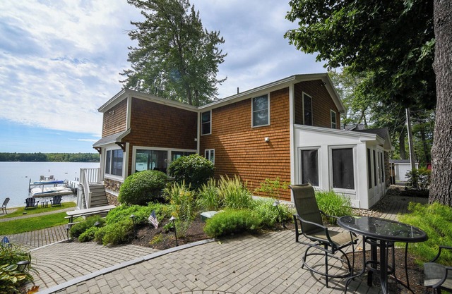 Stunning, updated home with breathtaking views over Sebago Lake Basin.