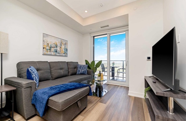 Stylish 1BR Condo w Balcony & Skyline Views