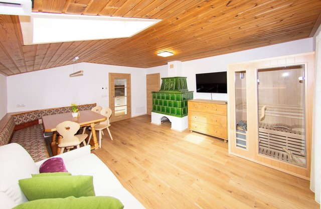 Stylish alpine apartment with tiled stove, sauna & panoramic view