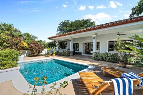 Stylish Home with Chic Decor, Luxury Amenities & Tropical Outdoor Oasis with Sparkling Private Pool