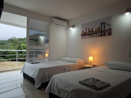 Suite Privada, Aire Acondicionado, Balcon y Piscina
