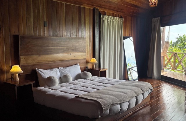 Suite with lagoon view, balcony and private pier