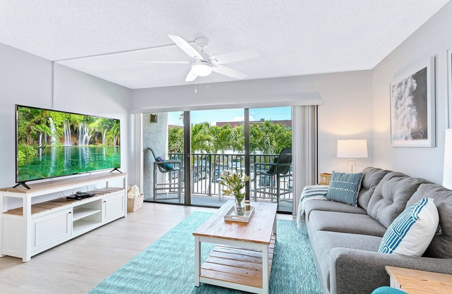 Sunny Shores Retreat: Pool, Balcony & Steps to the Ocean!