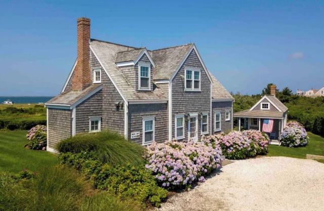 Superb quality cottage situated on Wauwinet Harbor with abounding view.