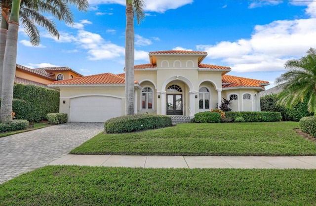 SW exposure home on wide canal with pool and spa