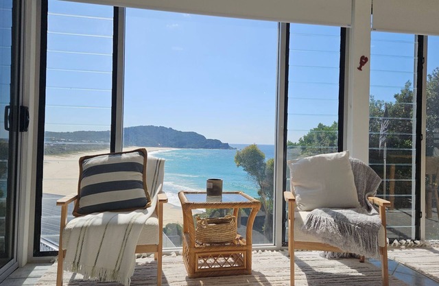 The Beach House, a stunning holiday home perched atop on the southern headland Boomerang Beach