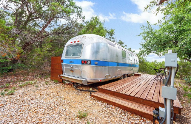 The Driftwoods - Vintage Blue Airstream for Unique Driftwood Getaway