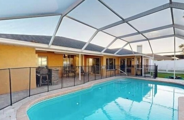 The Perfect Gateway Home with a large pool area, Gazebo, all fenced in.