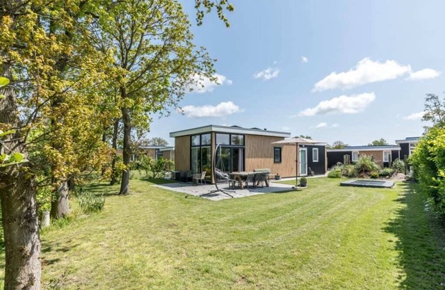 This attractive chalet is located in a beautiful location at the back of Schouwenduin, surrounded by