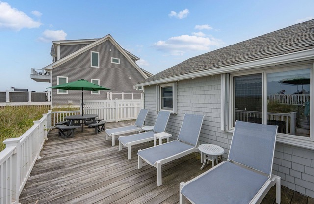 This enchanting cottage set atop the dunes of Sagamore Beach offers a vacation lifestyle you'll love