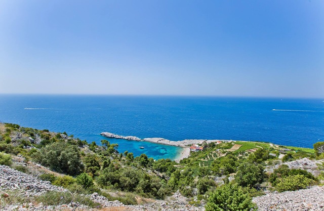 This is a house, with a large and astonishing view at the beach and open sea.