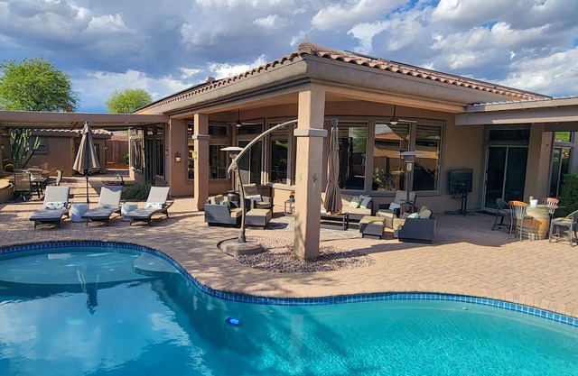 This stunning 3-bedroom, 3.5-bathroom home invites you to experience the ultimate desert getaway