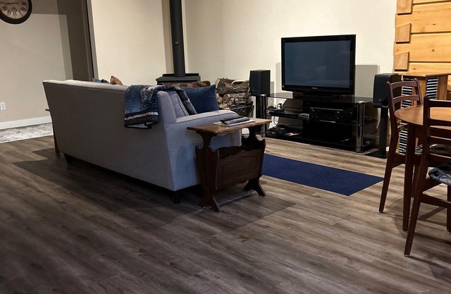 Timber cottage with large deck overlooking the water. Boat access only, no road.