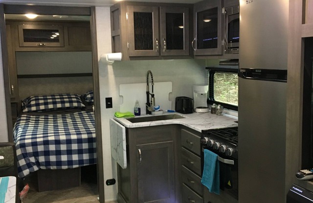 Travel Trailer in the woods