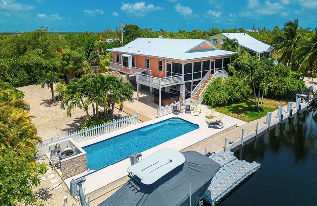 Tropical Oasis with Beautiful Home, Pool, Dock and Tiki Hut