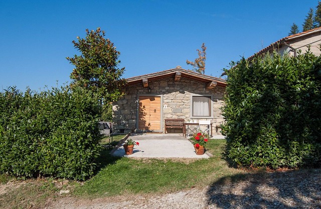 Tuscany, a medieval village with swimming pool and views of the castle of the Co
